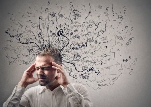 Guy holding his head in pain