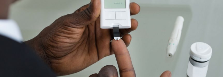 man with type 2 diabetes checks his blood sugar with device