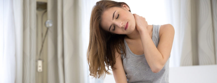 woman with hand on neck contemplates chronic pain management